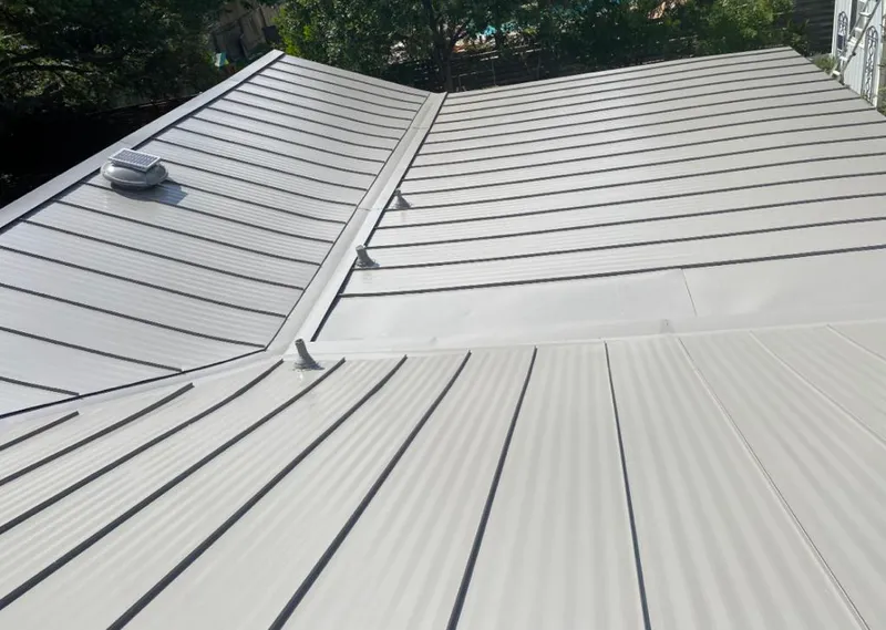 Solar attic fan installed on a metal roof for Roof Ventilation in Nazareth
